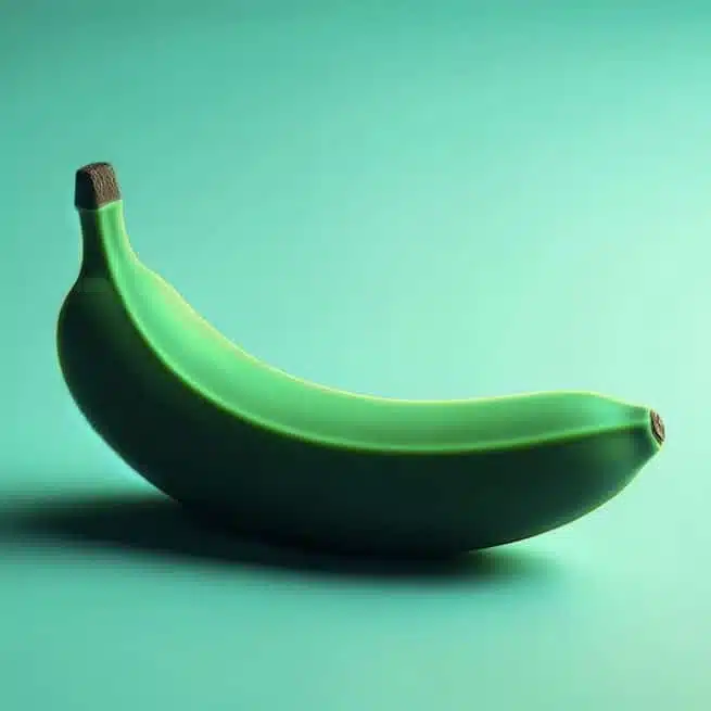 A single ripe banana on a teal background.